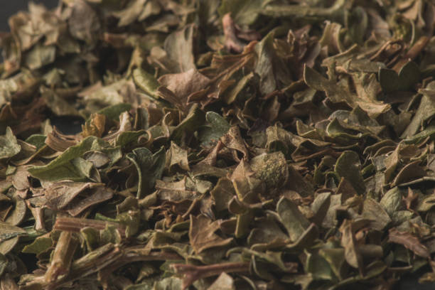 Texture of dried Marjoram herb leaves; culinary herb and spice A texture of dried Marjoram herb leaves; culinary herb and spice majoran stock pictures, royalty-free photos & images