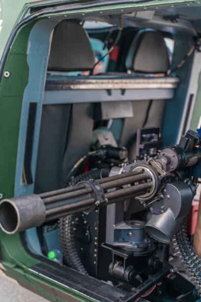 istock Closeup of a powerful rapid fire heavy machine gun with ammunition 1442116338