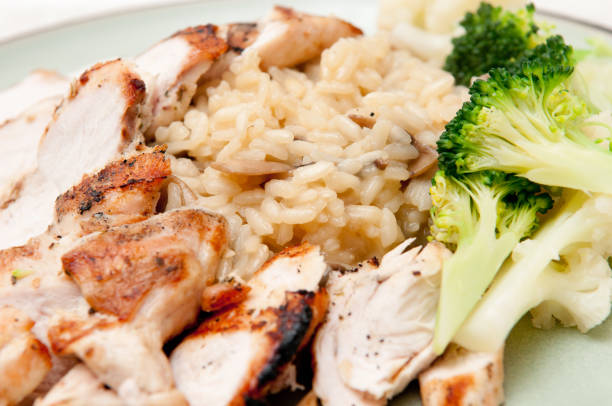 istock Roasted chicken breast and brown rice served with broccoli and cauliflower 1442117953