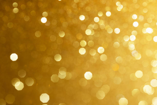 istock Golden glittering background for design and free space. 1442118696