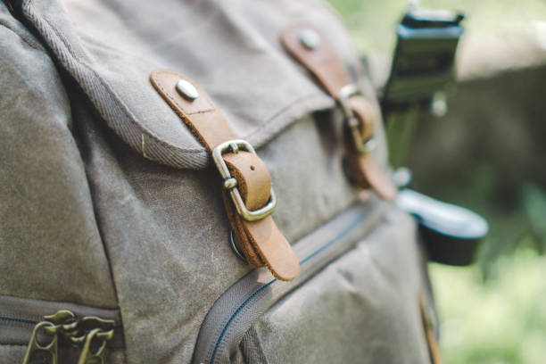 istock Closeup of a modern backpack with leather straps under the sunlight with a blurry background 1442119114