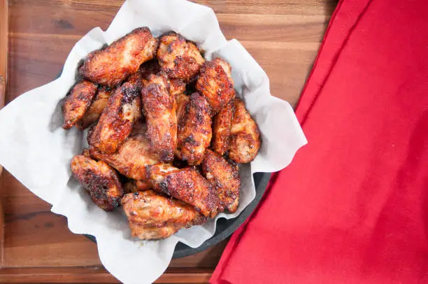 hot and spicy buffalo style chicken wings in a basket