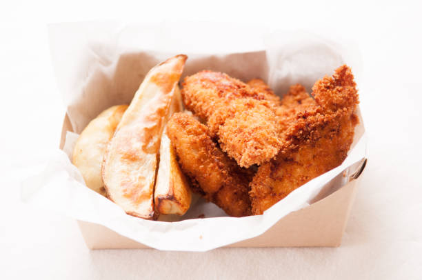 istock chicken strips and fries in a take out container 1442119239