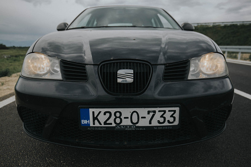 Brcko, Bosnia and Herzegovina – May 21, 2019: Shot of black Seat Ibiza car on road