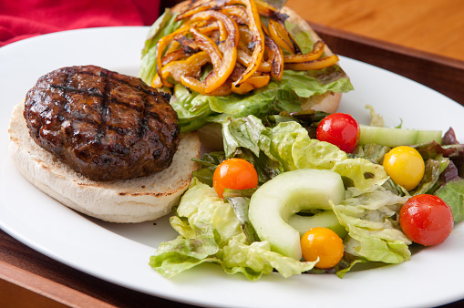 organic chipotle pork burger with sauteed peppers