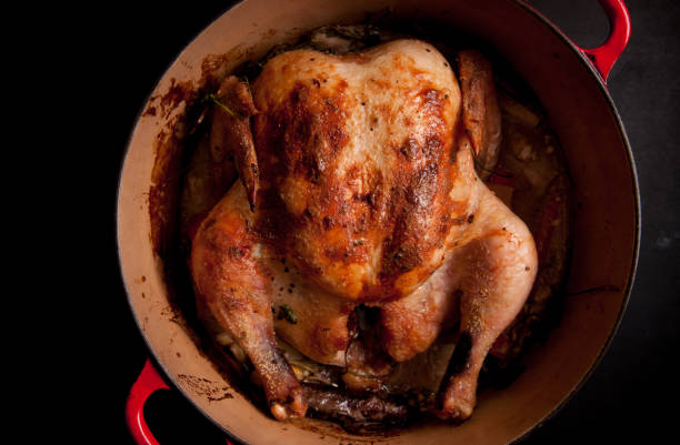 istock coconut whole chicken in a dutch oven 1442120492