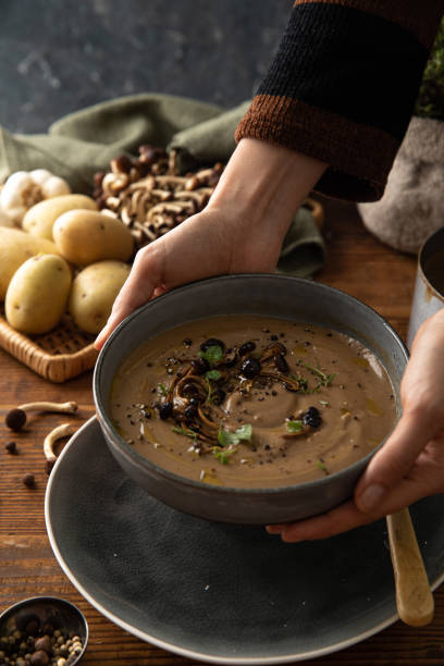 istock Mushroom soup with human presence 1442121367