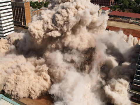 Fourth in series of demolition by implosion of four buildings in one block in Johannesburg to clear the way for a new parking lot for the new Gautrain underground railway line.     