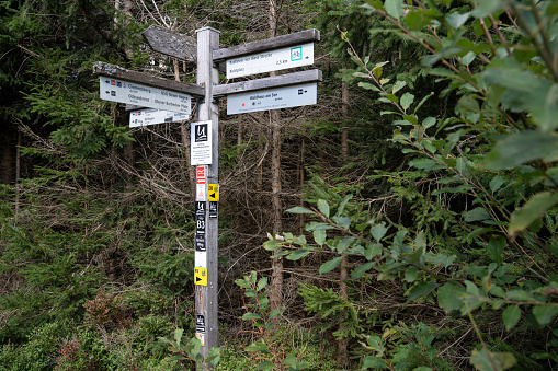 Willingen, Germany - September 22, 2022: Waymark of the long distance hiking trail Rothaarsteig on September 22, 2022 in Willingen, Sauerland, Germany
