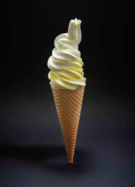 istock Vertical shot of soft vanilla ice cream in a cone 1442122787