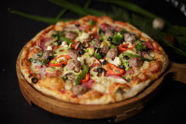 istock Deliciously prepared pizza with vegetables 1442122794