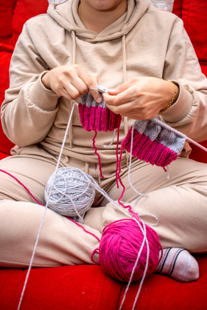 istock Girl with knitting needles. Handmade concept. 1442123938