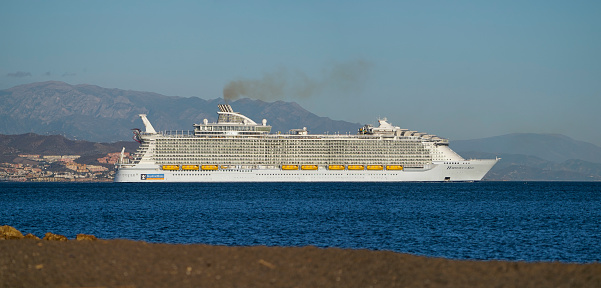 Malaga, Spain – November 03, 2021: MS Symphony of the seas, sea world's longest cruise ship leaving the harbour of Malaga, Southern Spain.