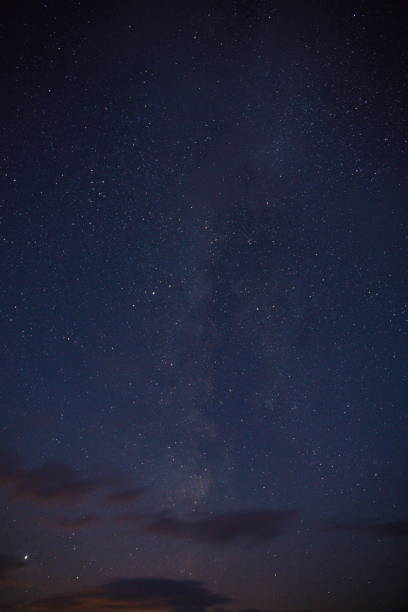 istock Vertical shot of the beautiful starry night sky 1442124191