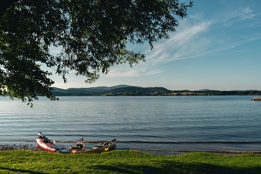 A closeup of kayaks on the shore of Lake Lipno on a beautiful sunny day in the Czech Republic