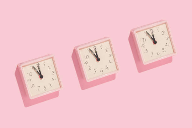 istock New Year countdown creative trendy pattern made with pink clocks on pastel pink background. 80s or 90s retro aesthetic fashion holiday concept. Minimal New Year party idea. 1442124581