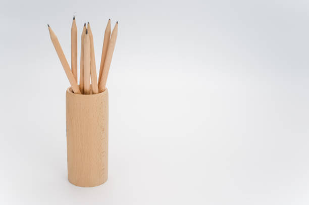 istock wooden pen holder with pencils on a white background 1442124802