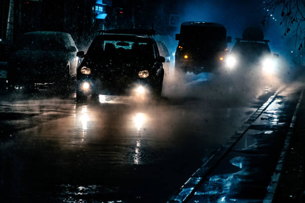 istock traffic on a heavy snowfall and rainy weather night 1442125630