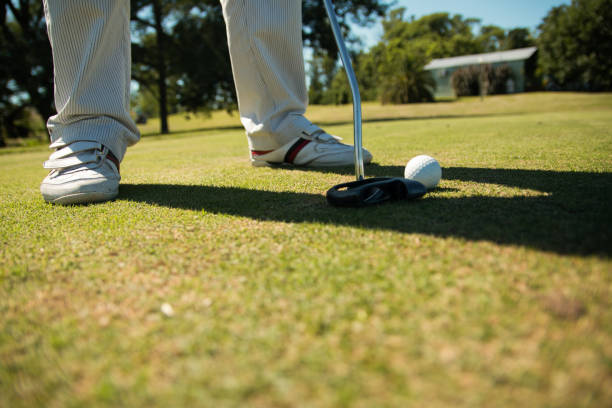 istock Male playing golf in the field 1442125652