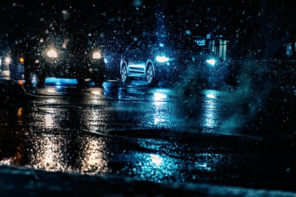 istock traffic on a heavy snowfall and rainy weather night 1442125707