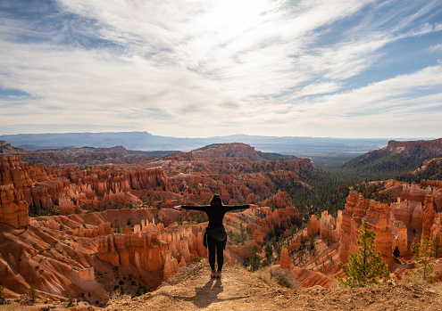 A female admiring the mesmerizing view of the Bryce Canyon National Park, the USA
