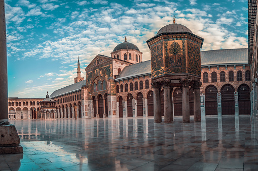 day panoramic view of the Umayyad mosque during a sunset. showing the Islamic architecture and Islamic art in this holy place in Damascus Syria.