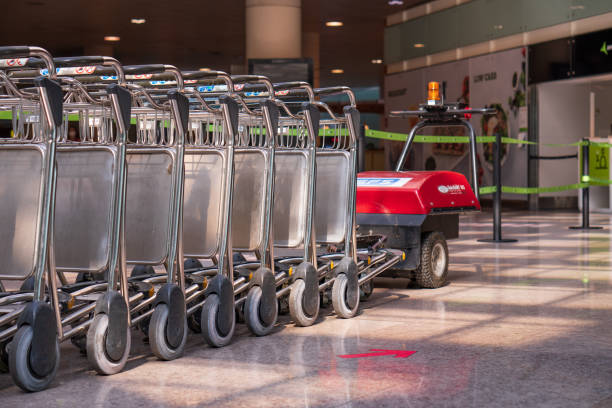 Naples, Italy – September 25, 2021: Trolleys luggage in a raw in modern airport.
