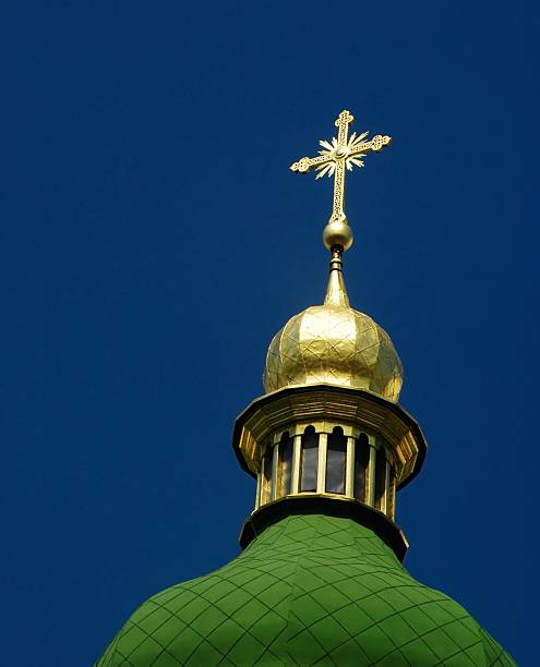 istock Orthodox temple tower with golden cross. 144212751
