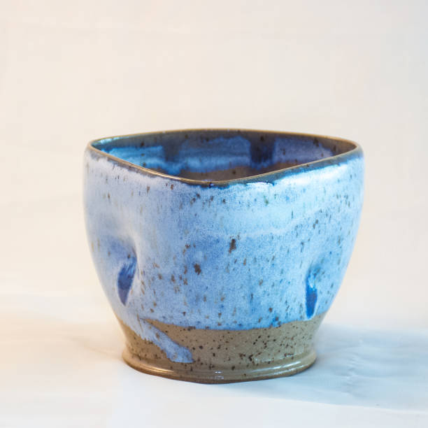 istock Closeup shot of a decorative ceramic blue mug isolated on white background 1442131738
