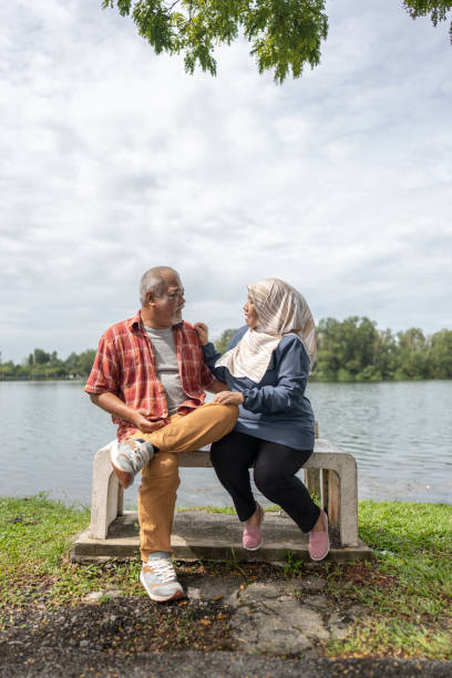 istock Happy senior people at lake 1442133231
