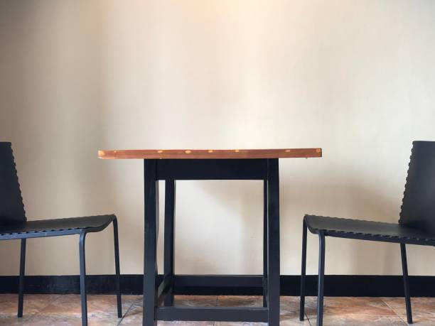 istock photo of empty table and chairs 1442136884