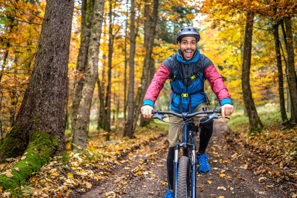 istock Man riding mountain bike in forest 1442139697