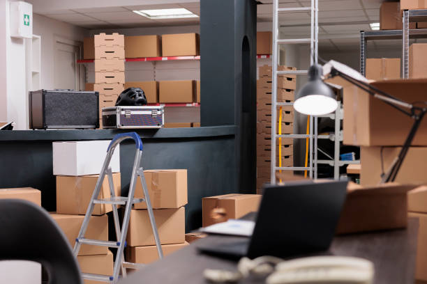 istock Empty interior of new large and modern warehouse space full with tall racks completely filled with cardboard boxes 1442139777