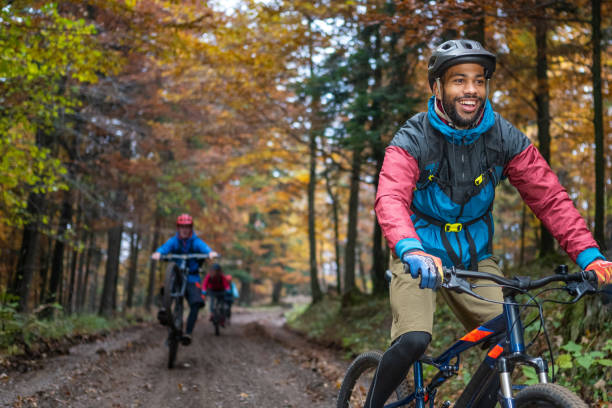 istock Man riding mountain bike in forest 1442139861