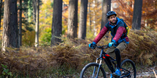 istock Man riding mountain bike in forest 1442139948
