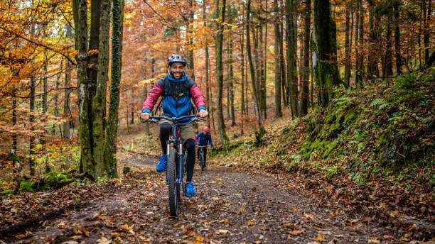 istock Man riding mountain bike in forest 1442140034