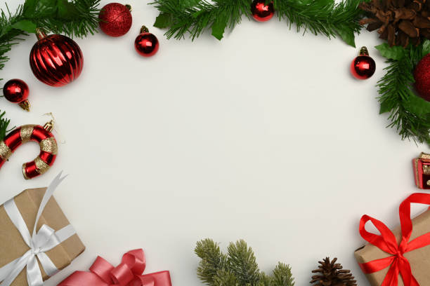 istock Christmas composition. Gift boxes, fir tree branches and Christmas ornaments on white background. Top view with copy space. 1442141273
