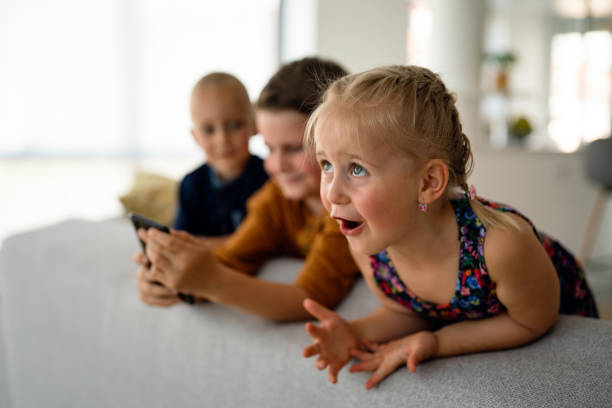 istock Portrait of happy children using digital devices and having fun together. 1442141502