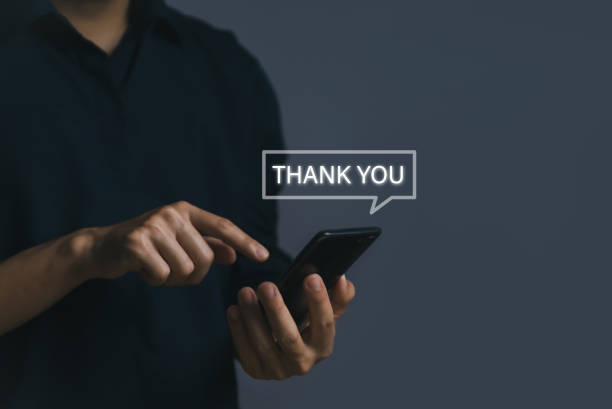 istock man using smartphone showing thank you message 1442144025
