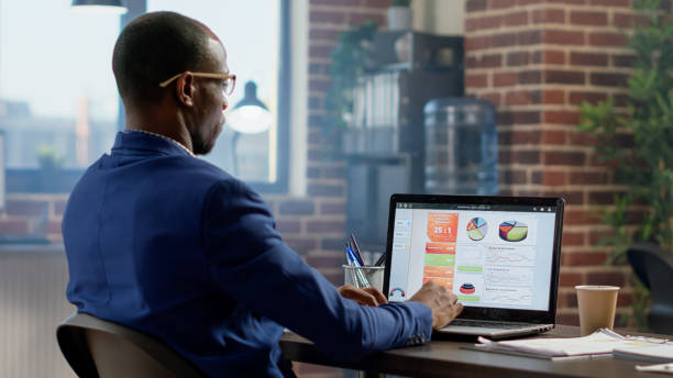 istock Company employee analyzing business information on laptop 1442146007