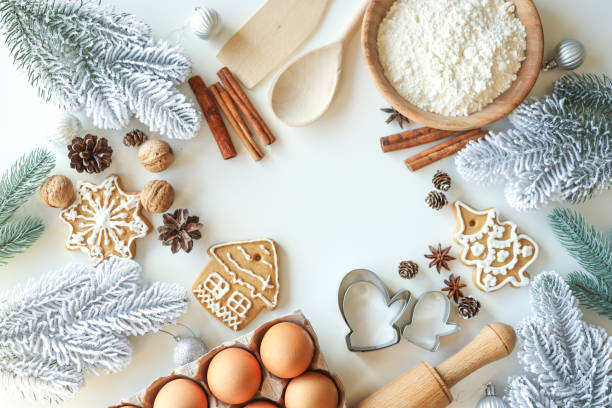 istock Bakery background with ingredients for cooking Christmas baking. Flour, eggs, cinnamon and gingerbread on the table top view 1442146647