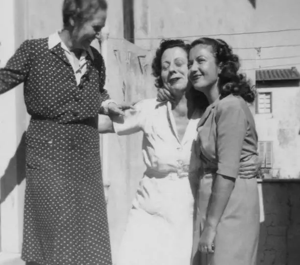 Grandmother and her daughters enjoyment on the balcony in 1952.