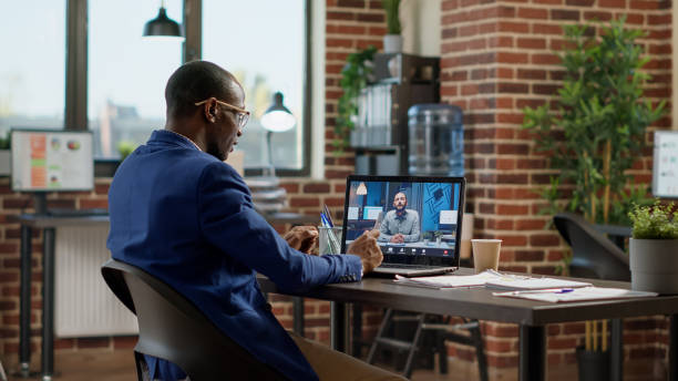 istock Businessman talking to manager on online teleconference call 1442147068