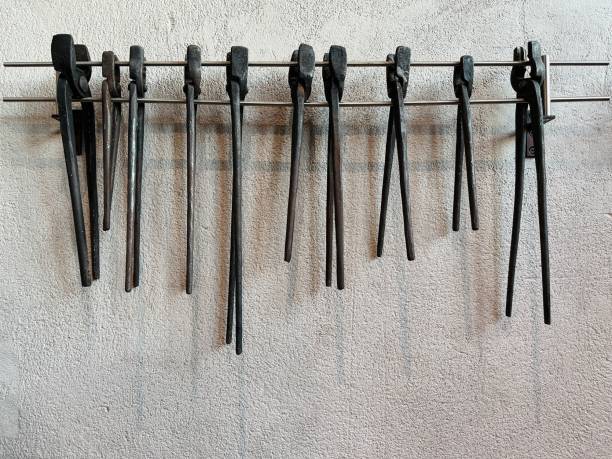 old vintage blacksmith pincers isolated over white background, clipping path
