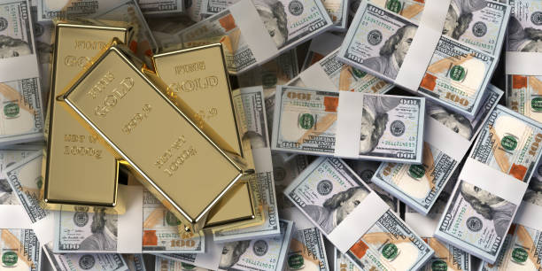 istock Gold bars on american dollar banknotes, top view 1442149524