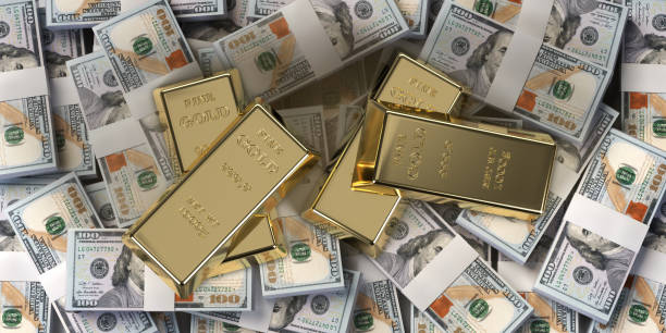 istock Gold bars on american dollar banknotes background 1442149535