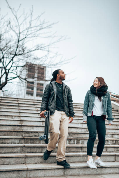 istock friends walking with the skateboard 1442151064