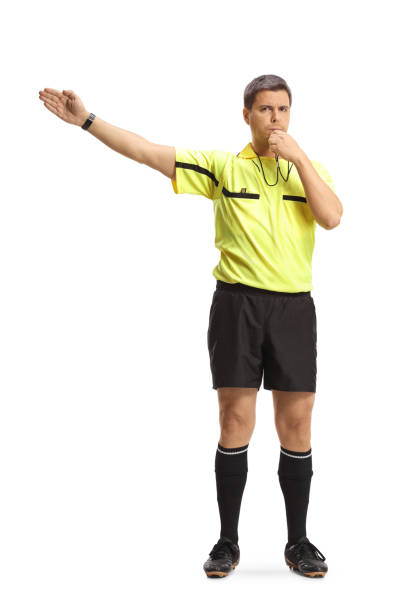 istock Football referee blowing a whistle and pointing with his hand 1442152758