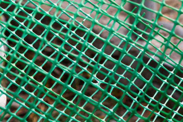 istock Plastic fence background, green fence close-up and texture 1442154333
