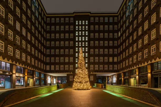 Chilehaus in the Kontorhaus quarter with Christmas tree, Hamburg, Germany. Advent time by Chilehaus in Hamburg .